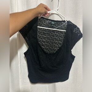 Never worn- lace mesh top. See through only from the back- never worn.